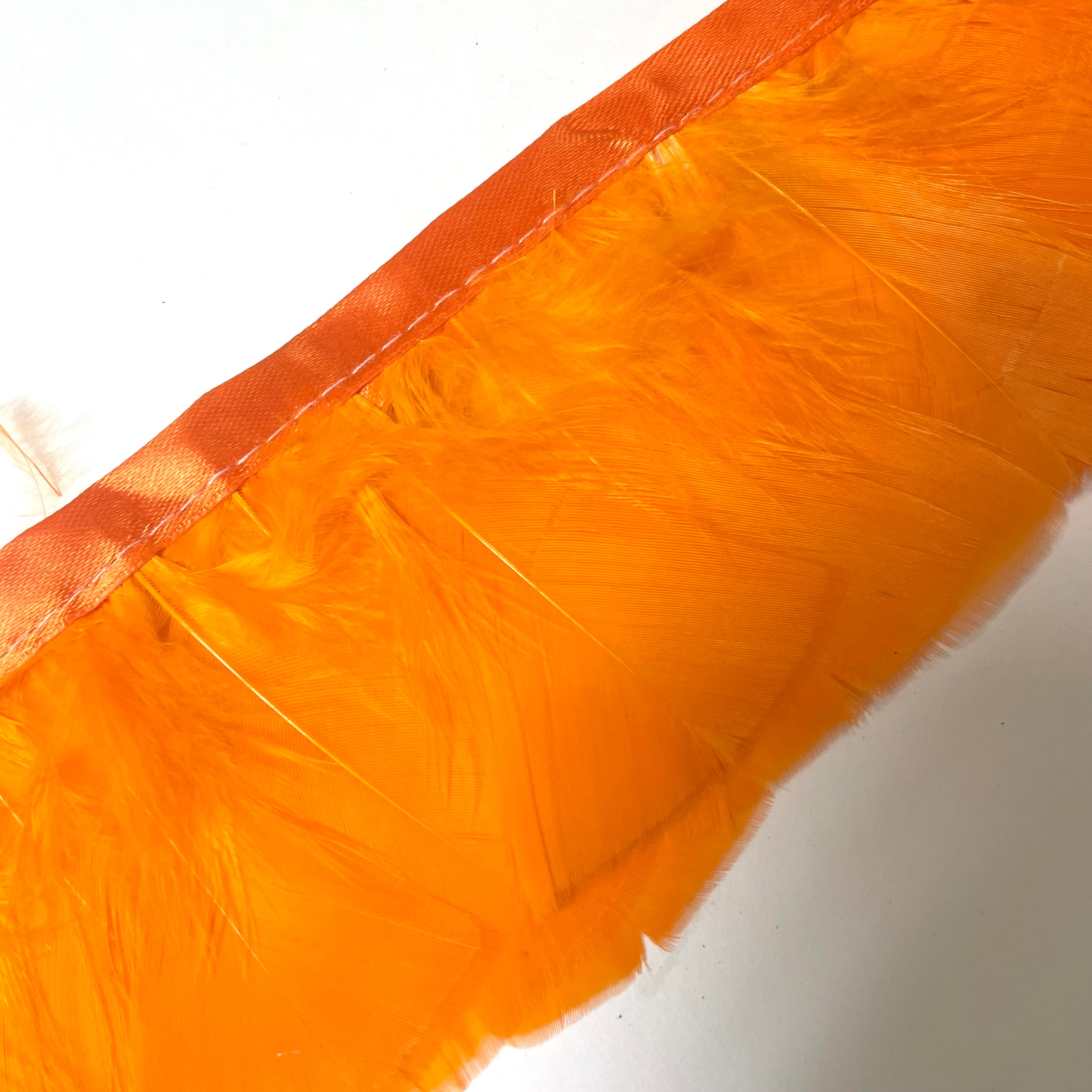 Turkey Plumage Feather Ribbon Strung per metre - Orange
